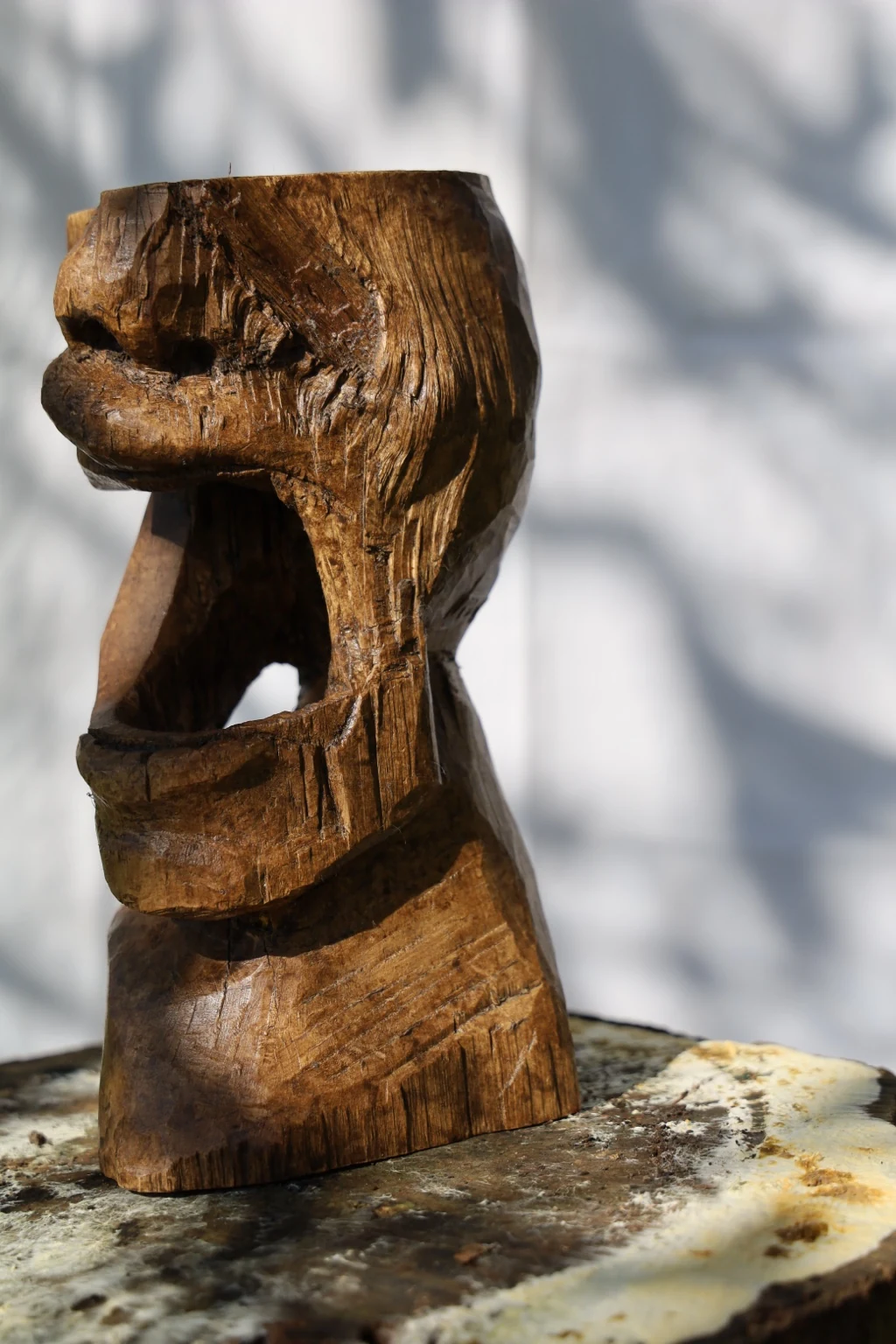 Almayer from the side, showing the open mouth and carved profile.