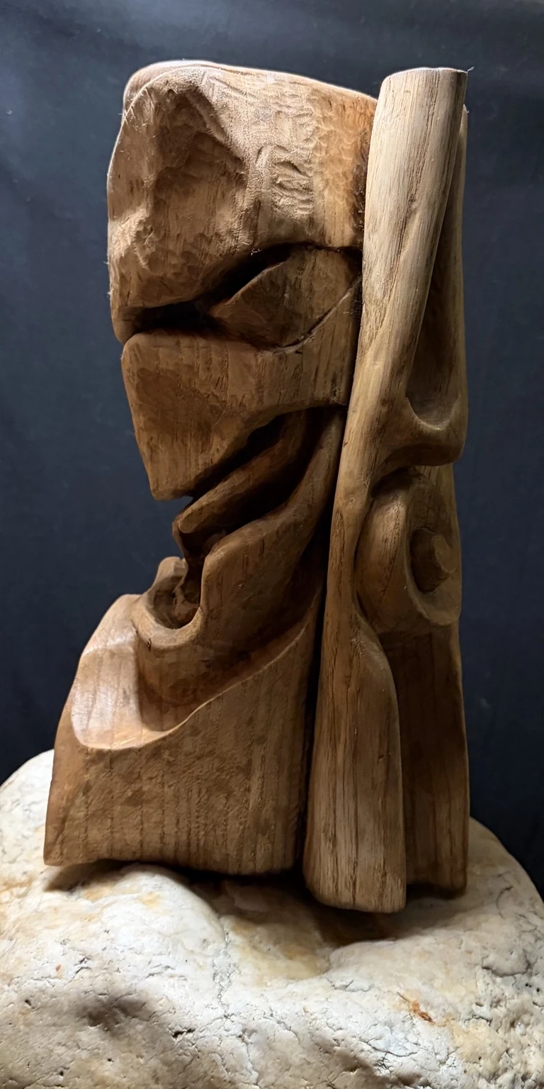 MacWhirr, profile showing the carved planes and folds.